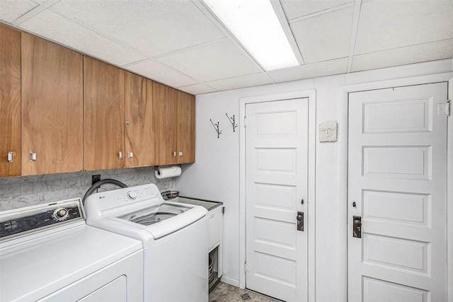 6073 Rocky Beach Ave, Charlevoix, MI 49720 - laundry area featuring cabinet space and washer and dryer