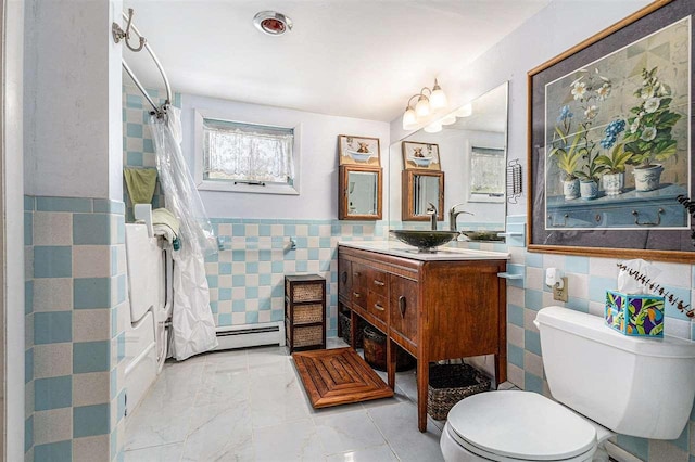 6073 Rocky Beach Ave, Charlevoix, MI 49720 - full bathroom with tile walls, toilet, vanity, a wainscoted wall, and a shower with shower curtain