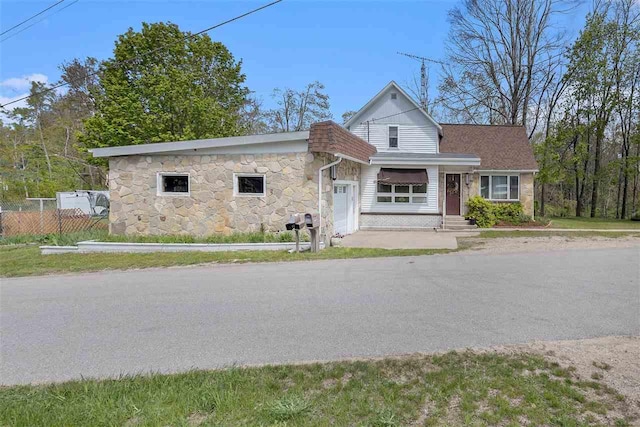 6073 Rocky Beach Ave, Charlevoix, MI 49720 - view of front facade with stone siding