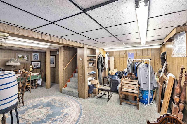 6073 Rocky Beach Ave, Charlevoix, MI 49720 - finished below grade area featuring wooden walls, stairway, and carpet
