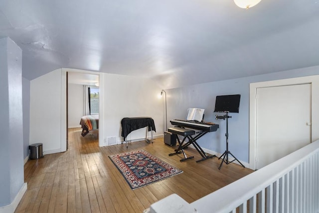 1117 E Mitchell St, Petoskey, MI 49770 - office space with wood-type flooring, baseboards, and lofted ceiling