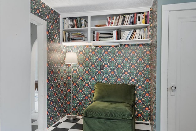 1117 E Mitchell St, Petoskey, MI 49770 - living area featuring tile patterned floors and wallpapered walls