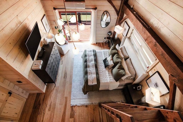 2149 Old Horton Bay Rd, Boyne City, MI 49712 - living area with wooden walls and wood-type flooring