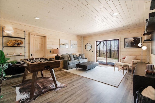 2149 Old Horton Bay Rd, Boyne City, MI 49712 - living room with wood ceiling, wooden walls, and wood finished floors