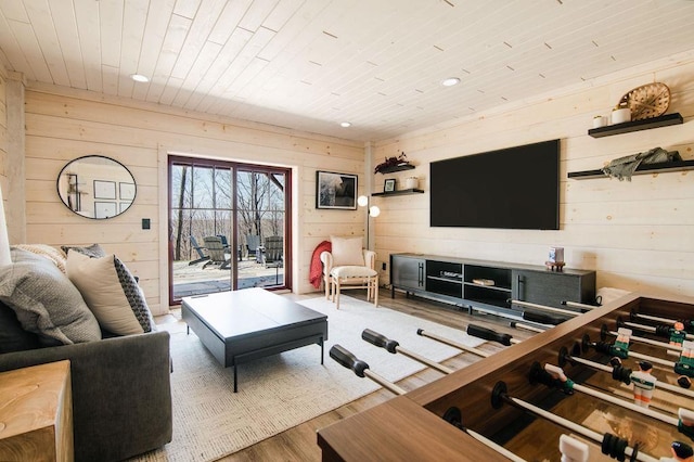 2149 Old Horton Bay Rd, Boyne City, MI 49712 - living area with wooden walls, wood ceiling, wood finished floors, and recessed lighting
