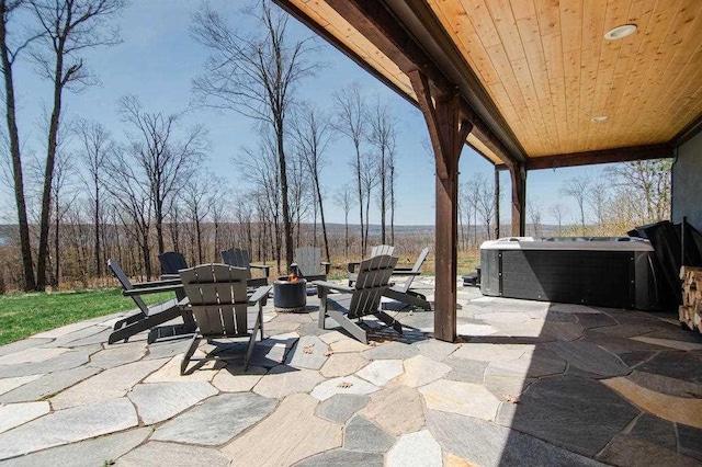 2149 Old Horton Bay Rd, Boyne City, MI 49712 - view of patio / terrace featuring a hot tub and a fire pit