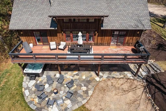 2149 Old Horton Bay Rd, Boyne City, MI 49712 - back of property featuring a deck and a patio area