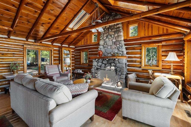 10819 Pioneer Trl, Boyne Falls, MI 49713 - living room featuring high vaulted ceiling, wood ceiling with exposed beams, rustic walls, plenty of natural light, and a stone fireplace