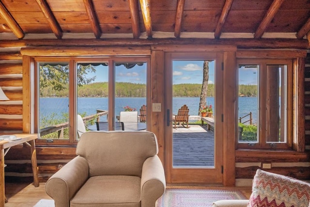10819 Pioneer Trl, Boyne Falls, MI 49713 - doorway featuring rustic walls, a water view, wooden ceiling with exposed beams, and wood finished floors