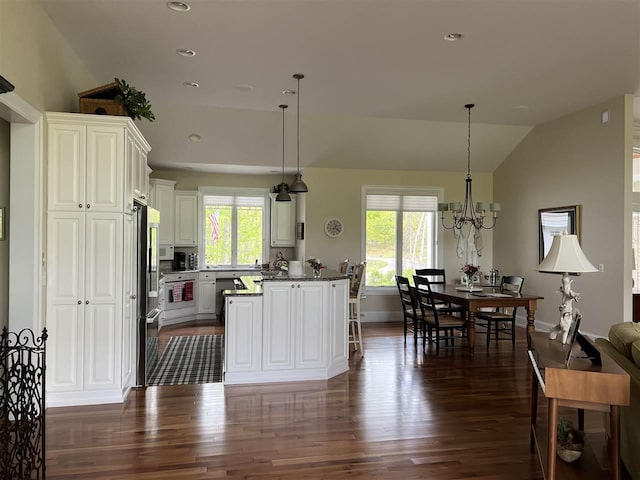 2112 Golfview, Harbor Springs, MI 49740 - kitchen featuring vaulted ceiling, dark wood-type flooring, stainless steel refrigerator, recessed lighting, and white cabinetry