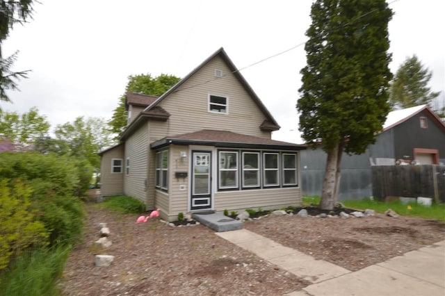413 E Main St, Boyne City, MI 49712 - view of front of home featuring a shingled roof
