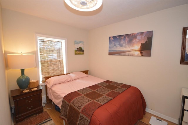 413 E Main St, Boyne City, MI 49712 - bedroom featuring wood finished floors and baseboards
