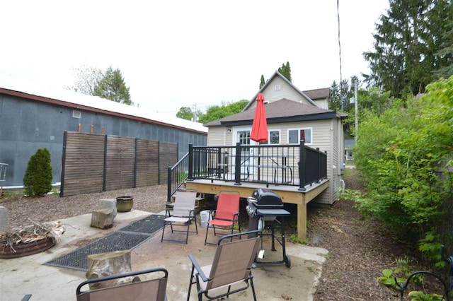 413 E Main St, Boyne City, MI 49712 - back of property with a patio area and a wooden deck
