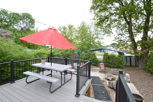 413 E Main St, Boyne City, MI 49712 - wooden terrace featuring outdoor dining area