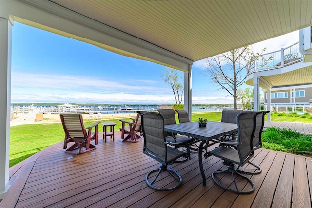 6040 Pine Lake Club Dr Unit 24, Charlevoix, MI 49720 - wooden terrace featuring outdoor dining space, a water view, and a yard