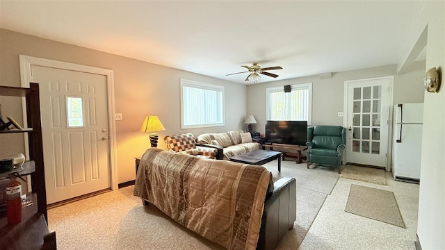 8902 Pickerel Lake Rd, Vanderbilt, MI 49795 - living area with a ceiling fan and light carpet