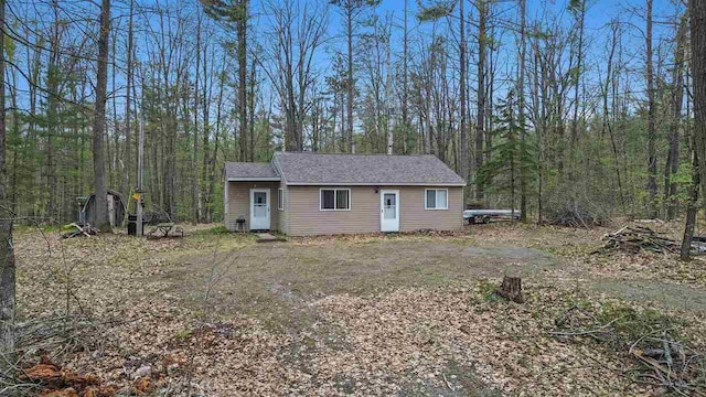 8902 Pickerel Lake Rd, Vanderbilt, MI 49795 - view of front of home with a wooded view