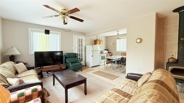 8902 Pickerel Lake Rd, Vanderbilt, MI 49795 - living room with a ceiling fan and light carpet