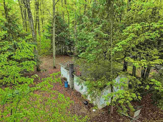 8705 Del Mason Rd, Mancelona, MI 49659 - aerial view of a heavily wooded area