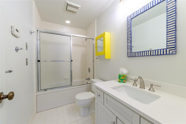301 Michigan Ave Unit 13, Charlevoix, MI 49720 - bathroom featuring toilet, vanity, enclosed tub / shower combo, and tile patterned floors