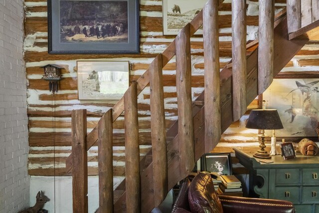 680 N Lake Shore Dr, Harbor Springs, MI 49740 - stairway featuring brick wall