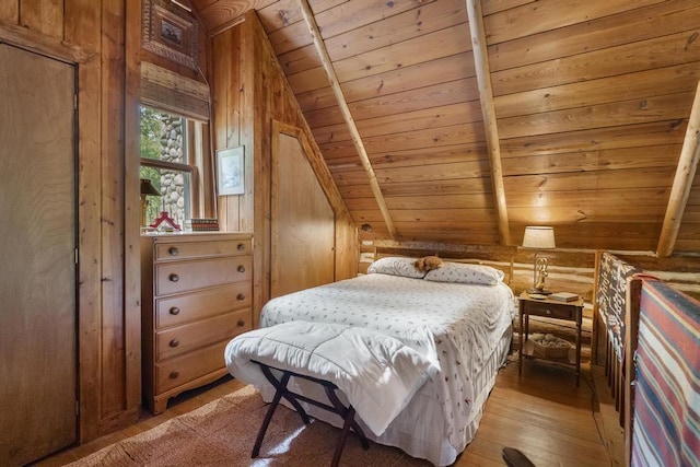 680 N Lake Shore Dr, Harbor Springs, MI 49740 - bedroom featuring wooden ceiling, lofted ceiling, light wood-type flooring, and wood walls