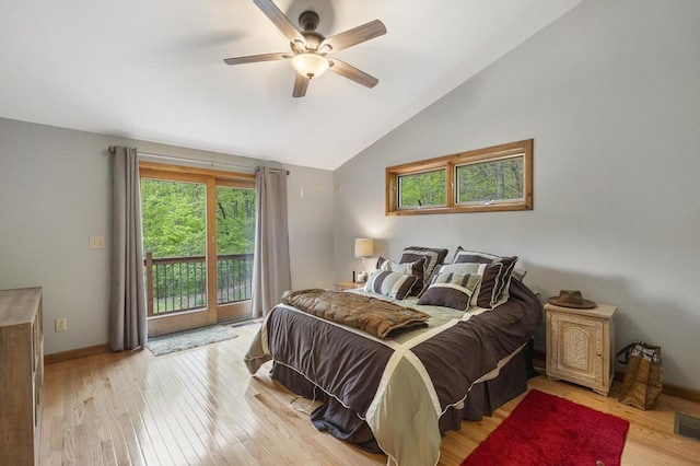 4545 Lintlong Rd, Petoskey, MI 49770 - bedroom with multiple windows, access to outside, light wood-style floors, baseboards, and high vaulted ceiling