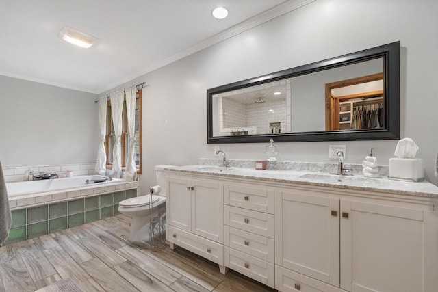 4545 Lintlong Rd, Petoskey, MI 49770 - bathroom with ornamental molding, double vanity, tiled tub, toilet, and a tile shower
