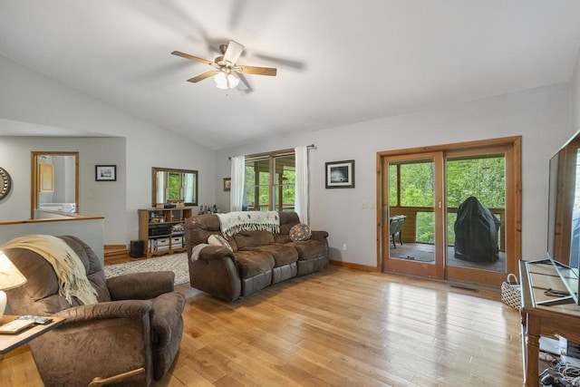 4545 Lintlong Rd, Petoskey, MI 49770 - living room with ceiling fan, vaulted ceiling, light wood-style floors, and baseboards