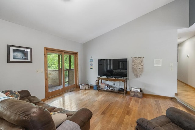 4545 Lintlong Rd, Petoskey, MI 49770 - living room featuring light wood-style floors, lofted ceiling, and baseboards