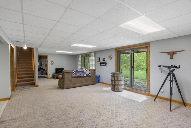 4545 Lintlong Rd, Petoskey, MI 49770 - carpeted living room featuring baseboards, stairway, and a drop ceiling