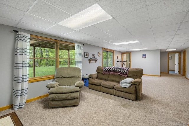 4545 Lintlong Rd, Petoskey, MI 49770 - carpeted living area with baseboards and a paneled ceiling