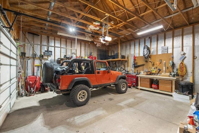 4545 Lintlong Rd, Petoskey, MI 49770 - garage featuring a workshop area and a garage door opener