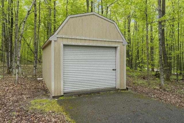 4545 Lintlong Rd, Petoskey, MI 49770 - garage featuring a wooded view