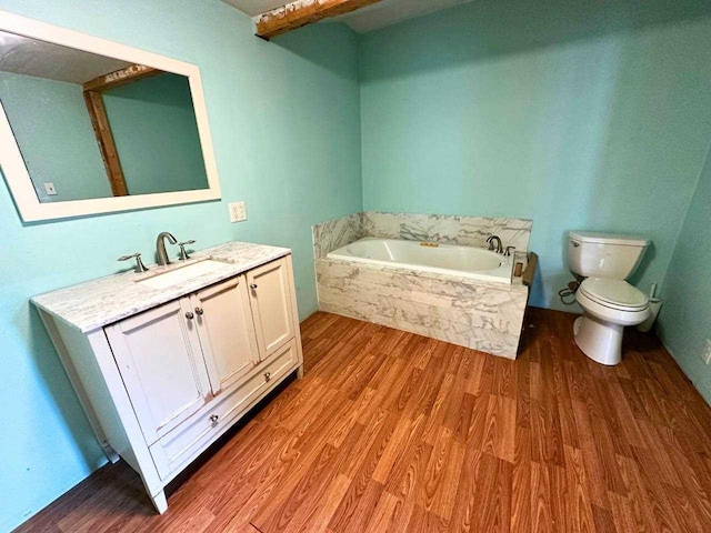 2378 E Old State Rd, East Jordan, MI 49727 - full bath with toilet, wood finished floors, a bath, and vanity