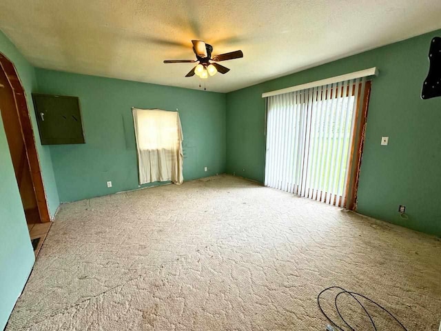 2378 E Old State Rd, East Jordan, MI 49727 - empty room with a ceiling fan and carpet floors