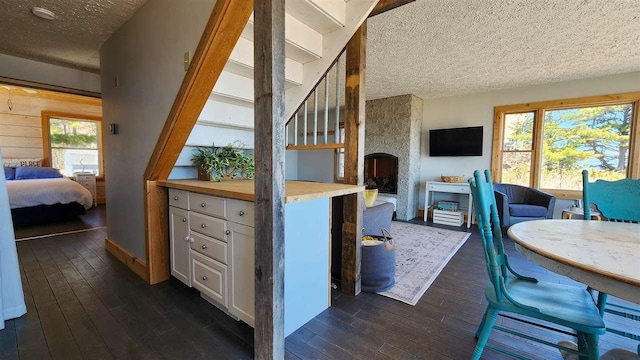 15718 N Blueberry Ln, Paradise, MI 49768 - interior space featuring a textured ceiling and hardwood / wood-style floors