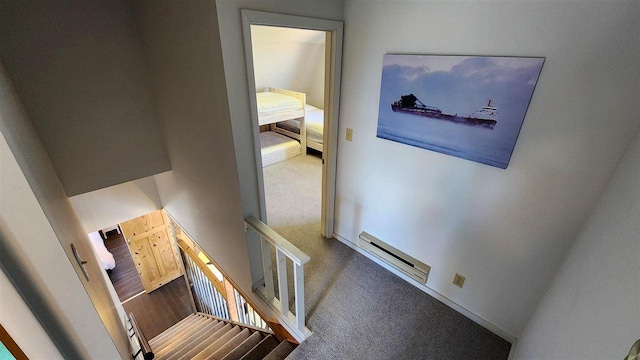 15718 N Blueberry Ln, Paradise, MI 49768 - staircase featuring carpet floors and a baseboard heating unit