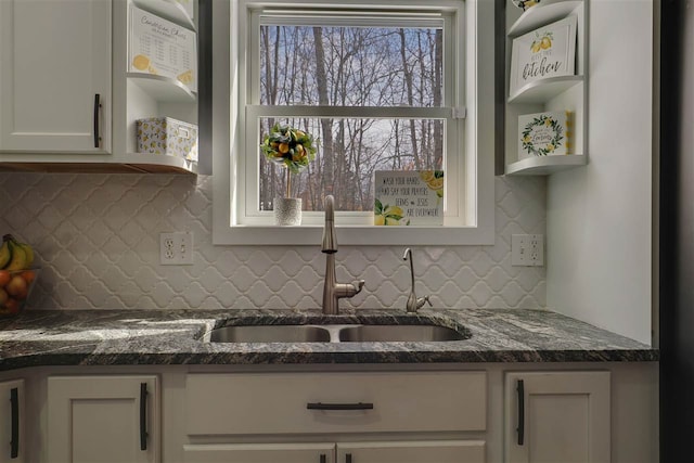 7101 Partridge Pl, Gaylord, MI 49735 - kitchen featuring a sink, open shelves, and decorative backsplash