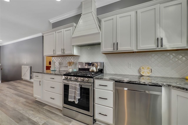 7101 Partridge Pl, Gaylord, MI 49735 - kitchen featuring appliances with stainless steel finishes, custom exhaust hood, ornamental molding, dark stone countertops, and tasteful backsplash