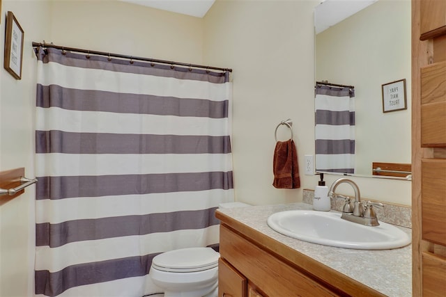7101 Partridge Pl, Gaylord, MI 49735 - bathroom featuring vanity, toilet, and curtained shower
