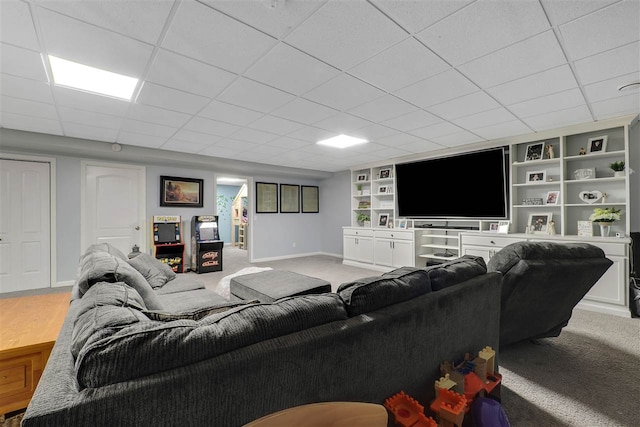 7101 Partridge Pl, Gaylord, MI 49735 - living room with baseboards, light carpet, built in features, and a paneled ceiling