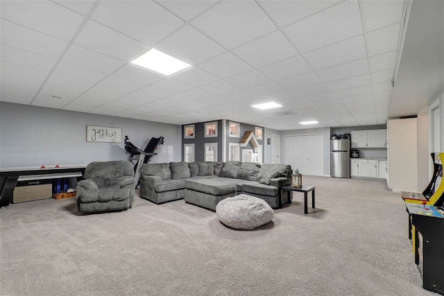 7101 Partridge Pl, Gaylord, MI 49735 - living room featuring light carpet and a drop ceiling