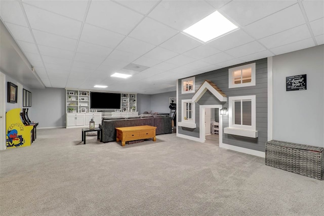 7101 Partridge Pl, Gaylord, MI 49735 - carpeted living room featuring a drop ceiling and baseboards
