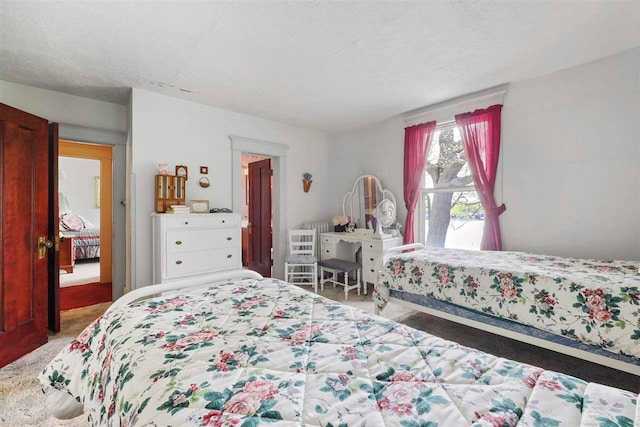 306 E Dixon Ave, Charlevoix, MI 49720 - bedroom featuring light carpet