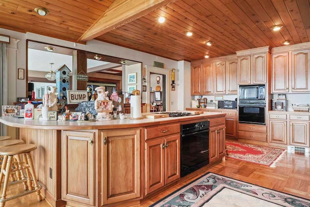 306 E Dixon Ave, Charlevoix, MI 49720 - kitchen featuring black appliances, light countertops, a kitchen bar, a kitchen island, and wood ceiling