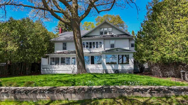 306 E Dixon Ave, Charlevoix, MI 49720 - view of front of property featuring a front lawn
