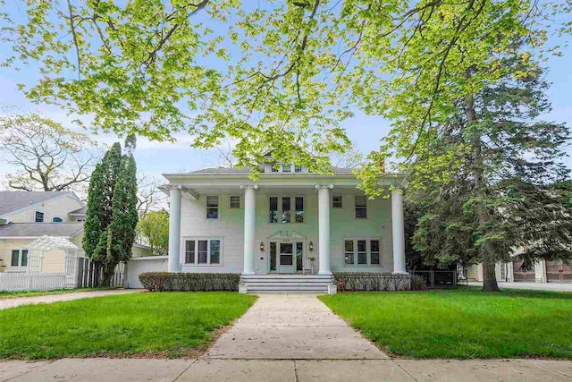 306 E Dixon Ave, Charlevoix, MI 49720 - neoclassical / greek revival house with a porch and a front yard
