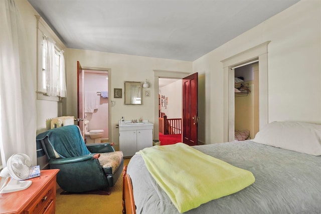 306 E Dixon Ave, Charlevoix, MI 49720 - bedroom with a sink and ensuite bath