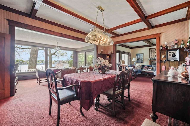 306 E Dixon Ave, Charlevoix, MI 49720 - dining room featuring carpet floors, a chandelier, coffered ceiling, and beam ceiling